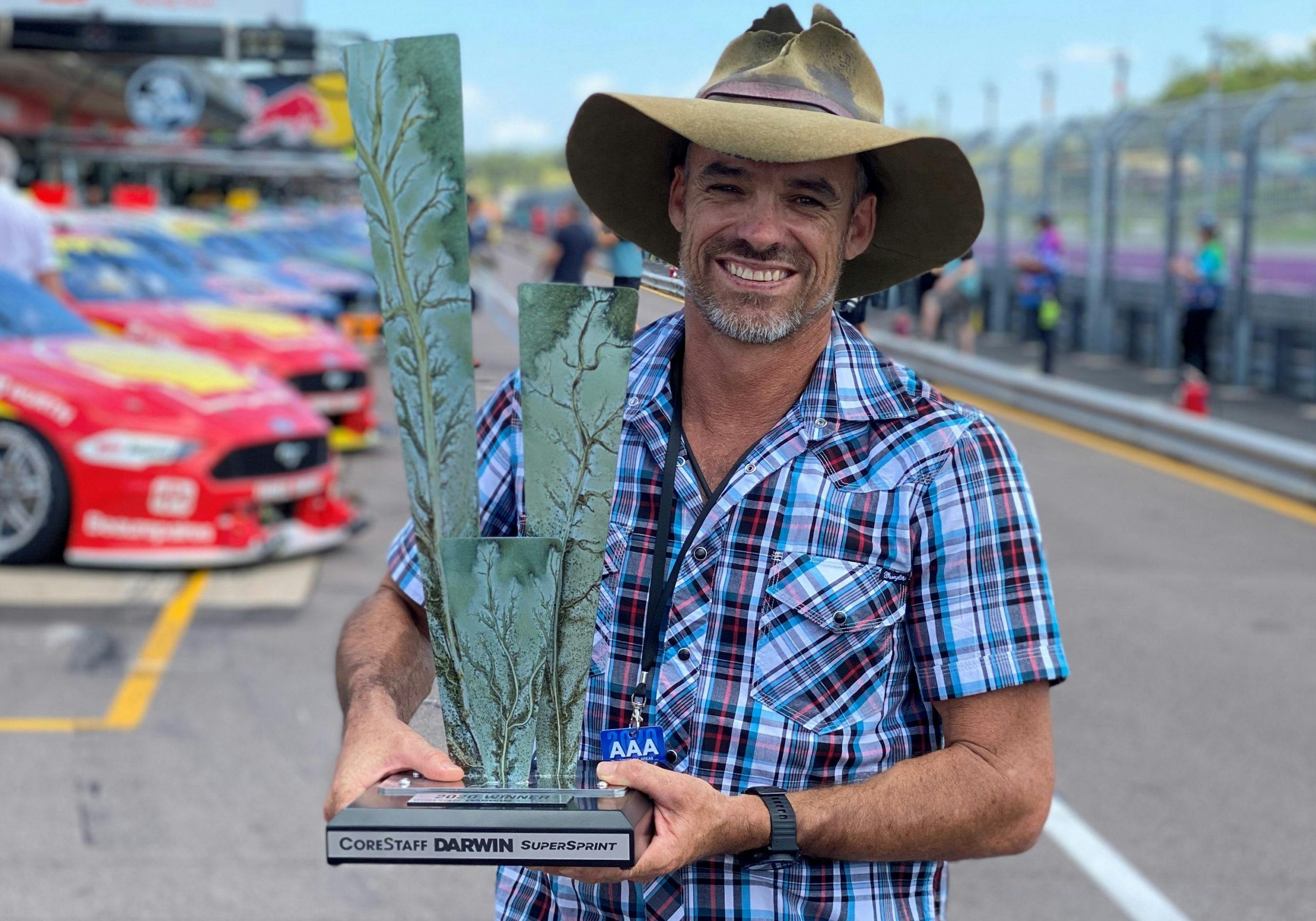 Man holding Supercars trophy