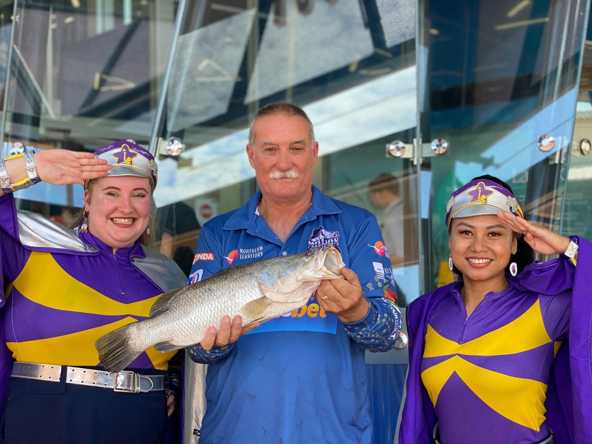 Tony McLean poses with two Captain Starlights and his winning barra